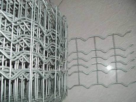 A roll of galvanized pipe-line reinforced mesh is placed on the ground.